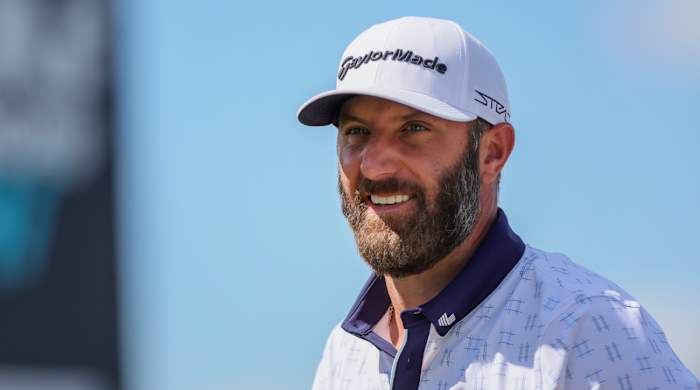 Dustin Johnson smiles while playing the LIV Golf Miami event in Doral, Fla.